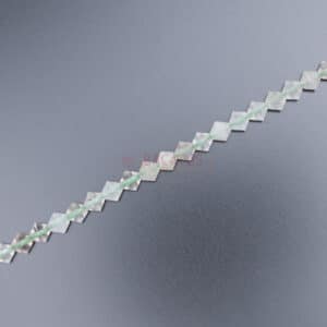 Fantôme quartz toupie facetté vert transparent environ 6x6mm, 1 fil